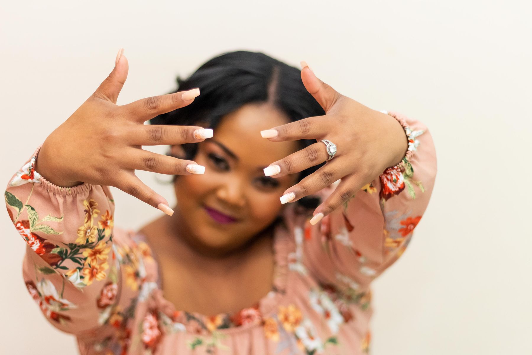 Smiling woman showing her finished nails